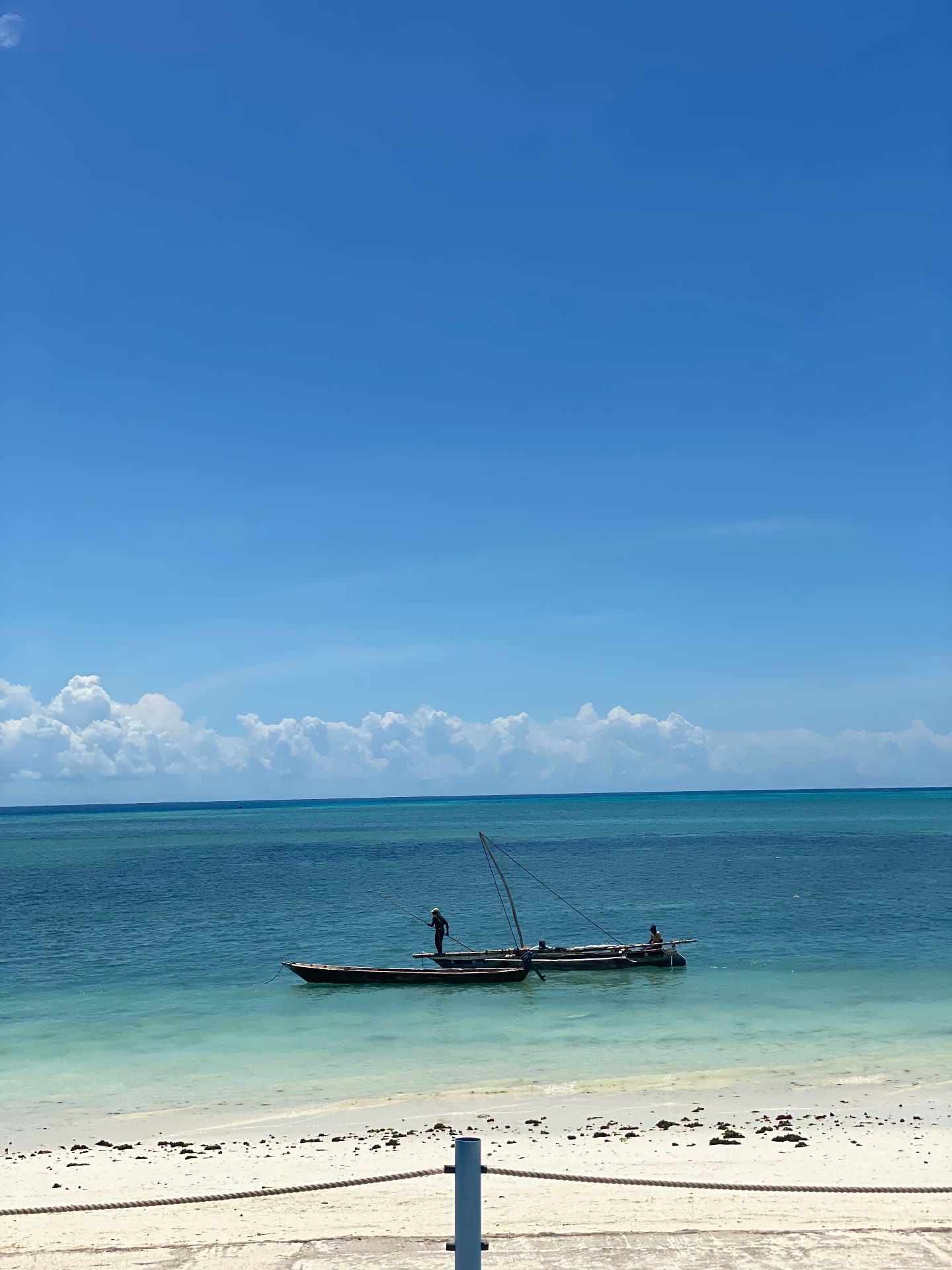 Fishing boat on a turquoise Zanzibar beach